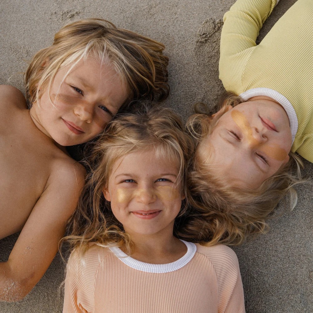 Shop our range of kids beach essentials including eco-friendly sunscreen, sand brushes, wide-brim hats, sunnies, beach fashion, hooded beach towels, ponchos + more! - Sunny Bliss - Australia